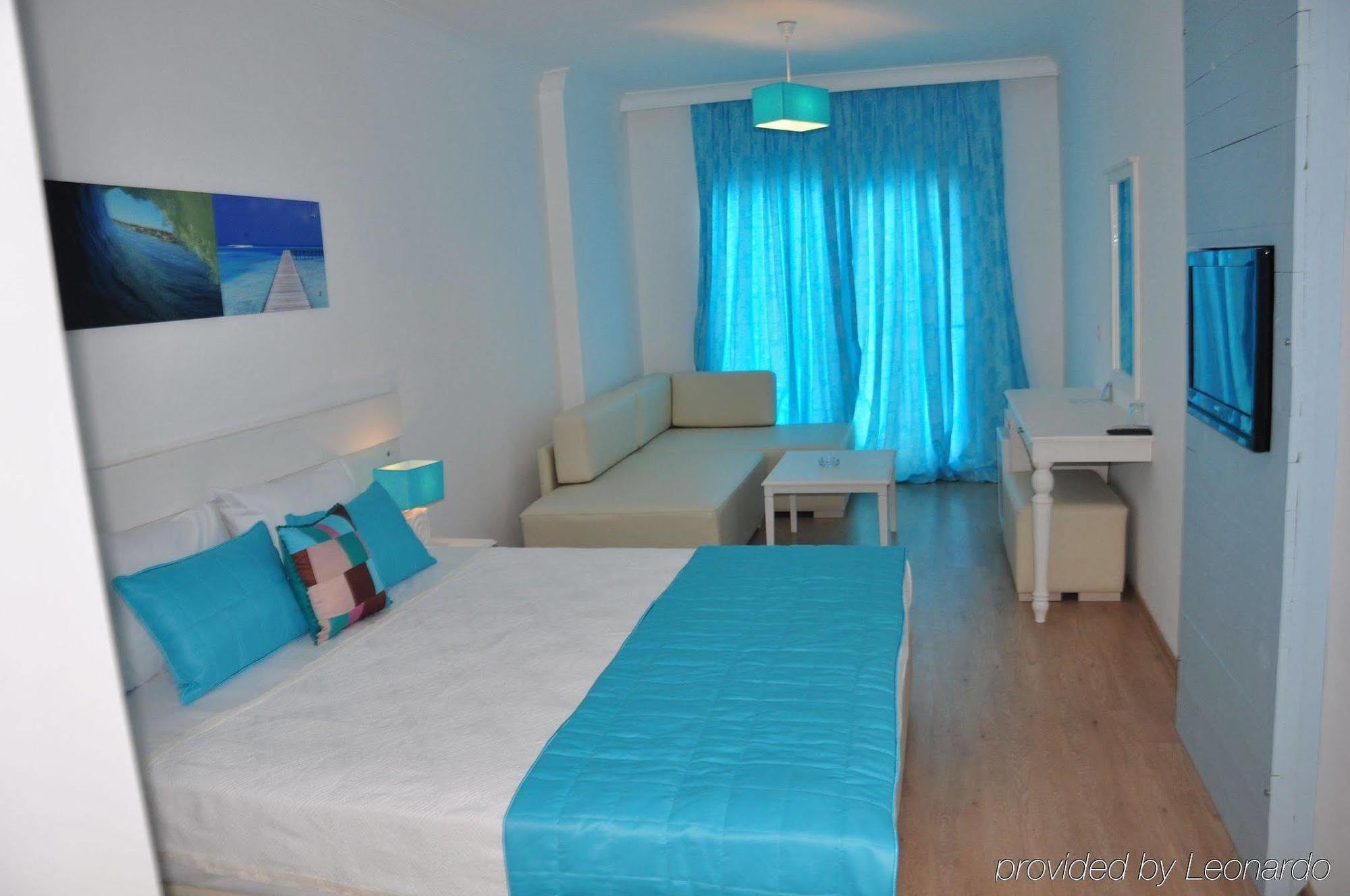 Otel Yeni Чесме Стая снимка
